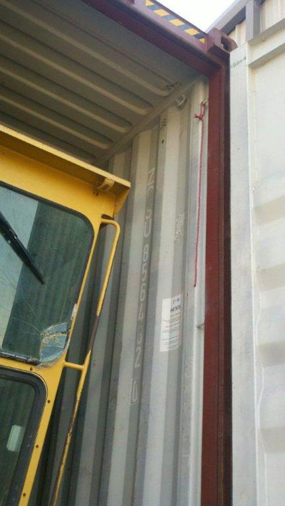 Export Logistics & Shipping, Inc. uses cube container to internationally ship Caterpillar 140G grader
